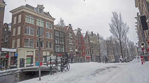 Building against sky during winter