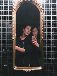 Portrait of two friends in mirror