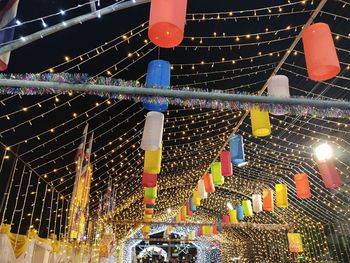 Low angle view of illuminated christmas lights hanging from ceiling