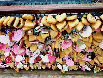 Low angle view of padlocks hanging on railing