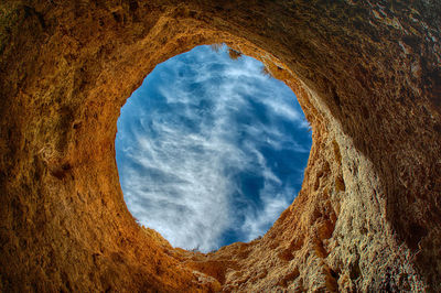 Scenic view of sky seen through hole