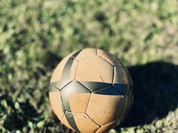 Close-up of soccer ball on grass