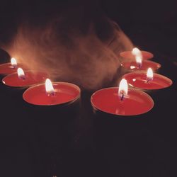 Close-up of illuminated tea light candles