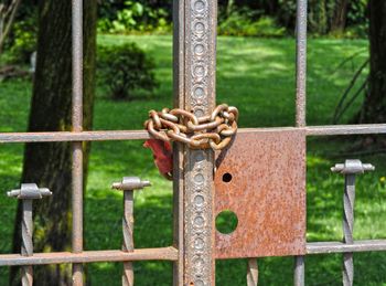 Close-up of padlock on metal railing