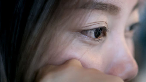 Close-up of woman looking away