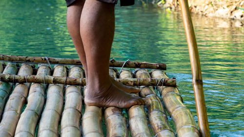 Low section of woman swimming in pool