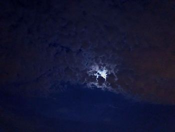 Low angle view of moon in sky at night