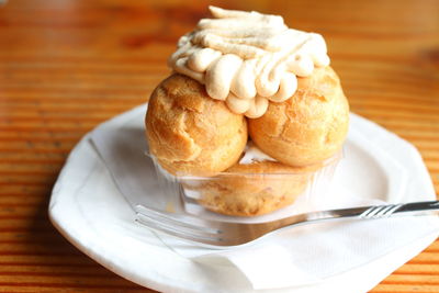 Close-up of cream puffs served in plate