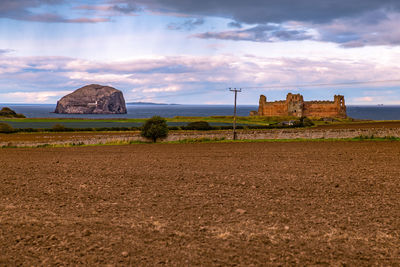 Castle against cloudy sky