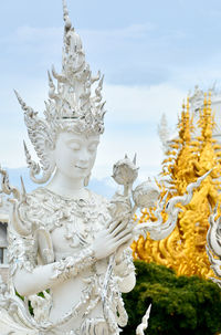 Statue of buddha against sky