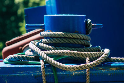 Close-up of rope tied to wooden post