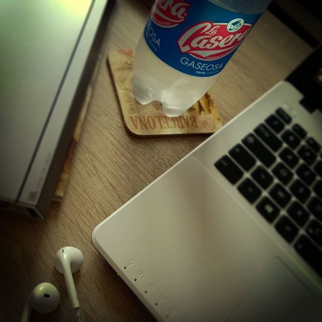 indoors, table, high angle view, still life, communication, book, paper, text, food and drink, education, wireless technology, technology, absence, close-up, home interior, no people, pen, western script, wood - material, empty