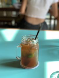 Close-up of drink in glass jar on table