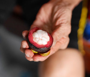 Close-up of hand holding ice cream