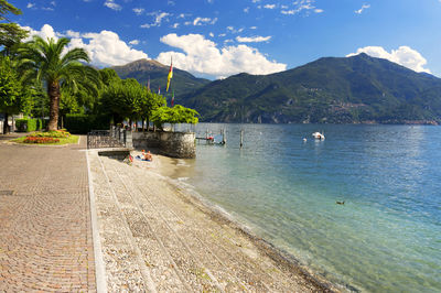 View of calm sea against mountain range