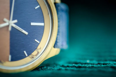 Close-up of clock on table