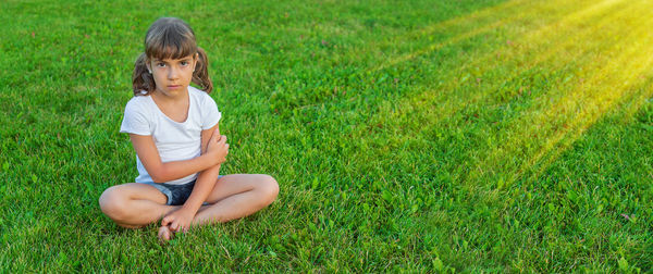 Full length of boy playing on field