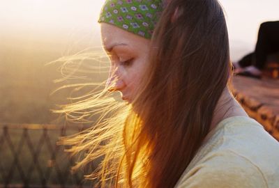 Side view of thoughtful young woman