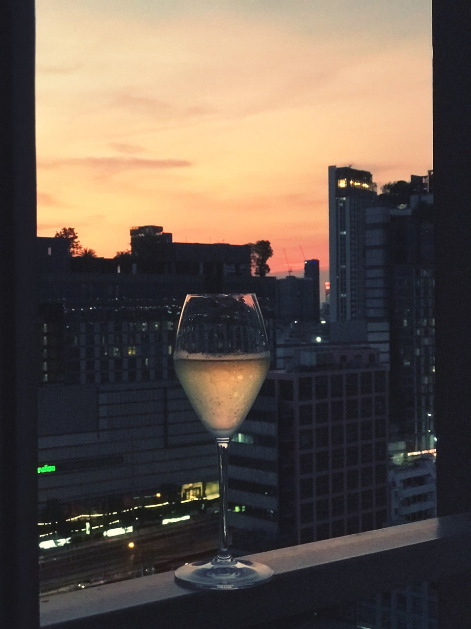 CITYSCAPE AGAINST SKY AT SUNSET