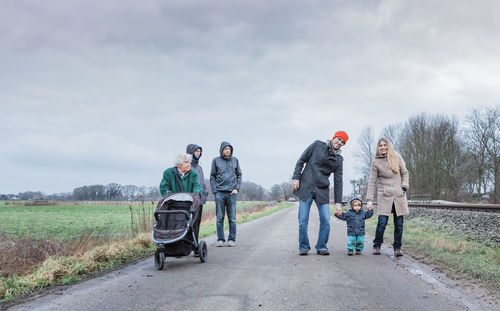 People on street against sky