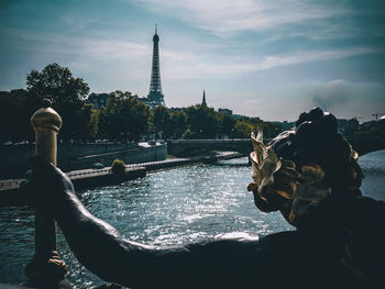 Rear view of woman standing by fountain