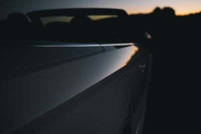 Close-up of convertible car during sunset