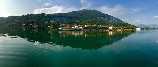 Scenic view of lake and mountains against sky