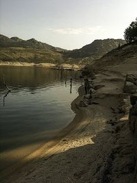 Scenic view of lake with mountains in background