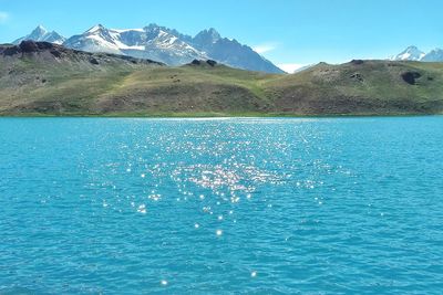 Scenic view of lake against blue sky