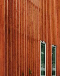 Window on brown metal wall