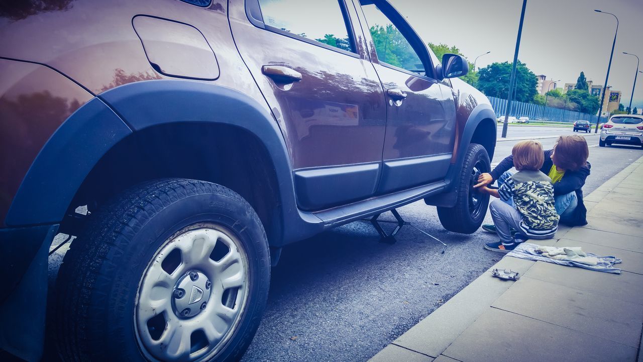 PEOPLE ON CAR ON ROAD