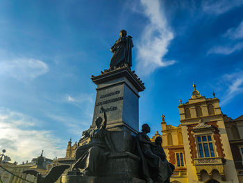 Low angle view of statue against building