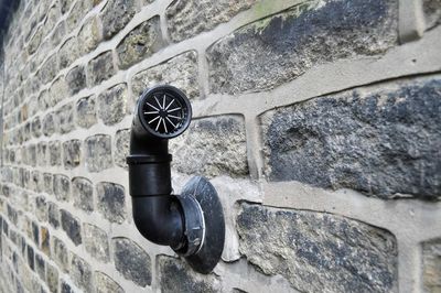 Air duct on stone wall