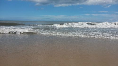 Scenic view of beach against sky