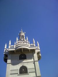 Low angle view of built structure against blue sky