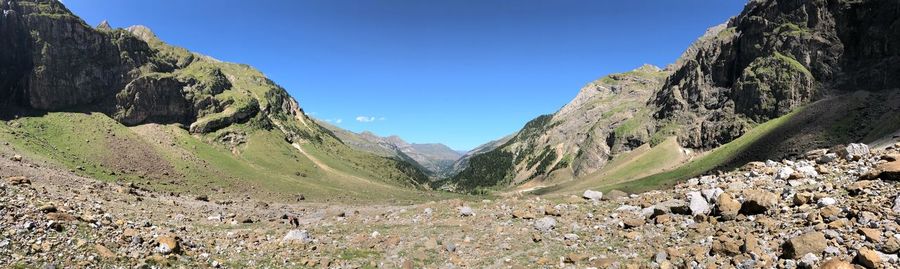 Scenic view of rocky mountains against clear blue sky