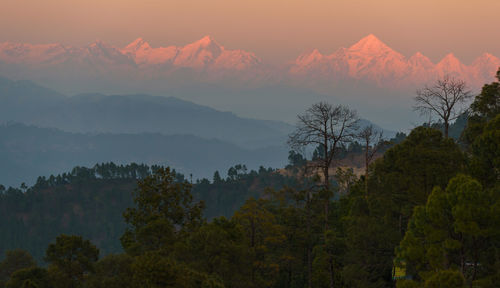 Scenic view of mountains against sky during sunset