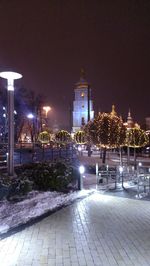 Illuminated city at night during winter