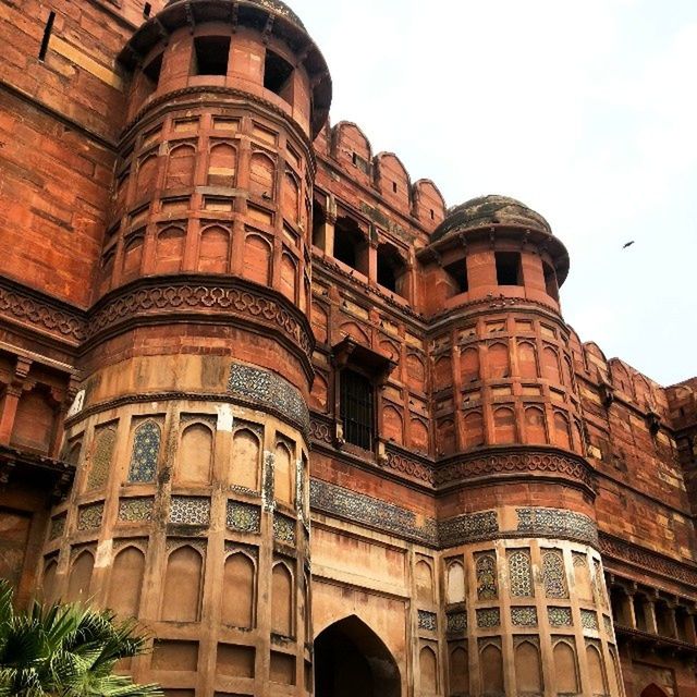 architecture, built structure, building exterior, low angle view, arch, history, window, sky, building, facade, city, architectural column, old, travel destinations, day, exterior, outdoors, famous place, architectural feature, no people