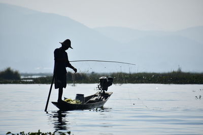 Man fishing in lake