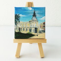Close-up of chair on table against white wall