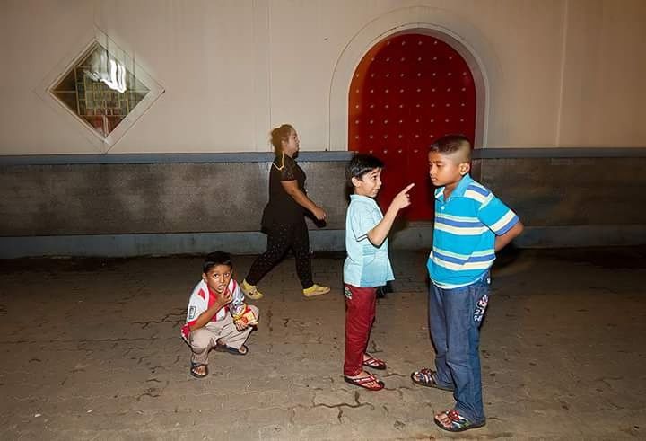 BOY STANDING IN A GIRL