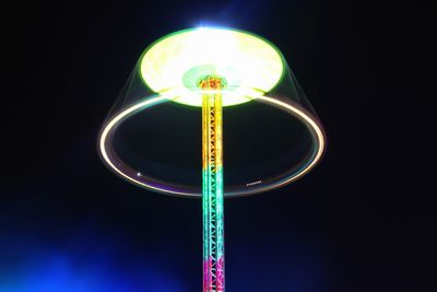 Low angle view of illuminated lights at night