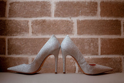 Low section of woman standing on footpath