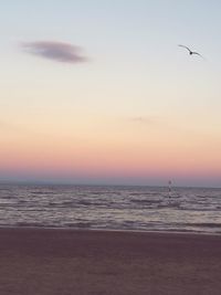 Scenic view of sea against clear sky during sunset