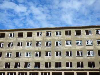 Low angle view of abandoned building against sky