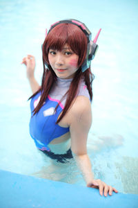 Portrait of woman with red hair in swimming pool