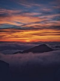 Scenic view of dramatic sky during sunset