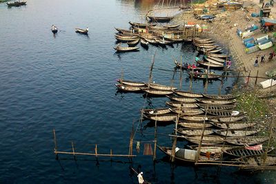 Boats moored in water