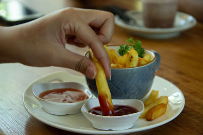 Midsection of person preparing food on table